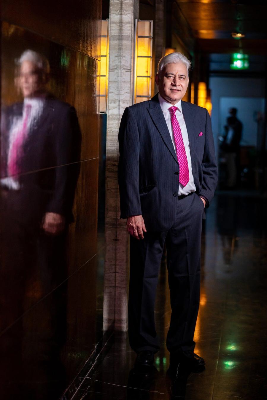 Anil Bholla standing in a hotel corridor